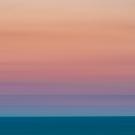 pink, orange, and yellow sunset with a blue ocean horizon